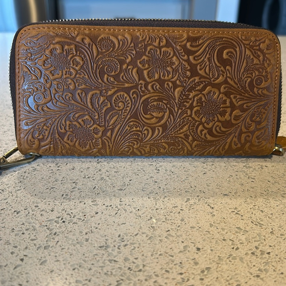 Brown and tan zipper wrist wallet.